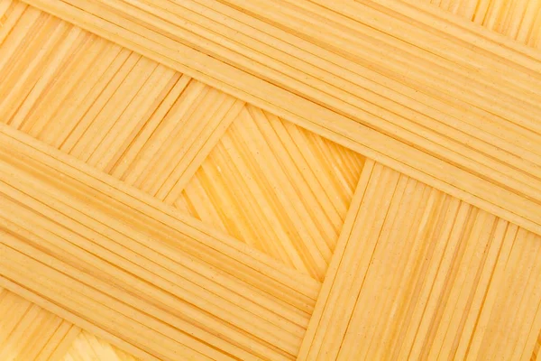 Een Achtergrond Gemaakt Van Droge Rauwe Spaghetti Een Close Zicht — Stockfoto