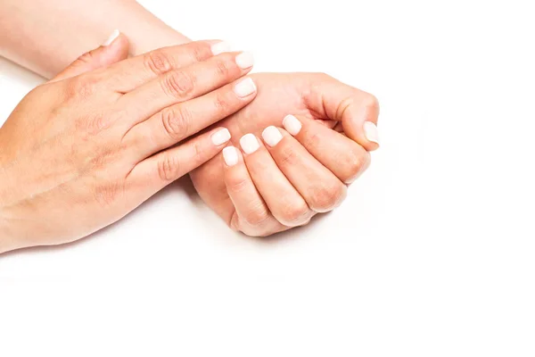 stock image Woman hands with white nails on a white background with copy space