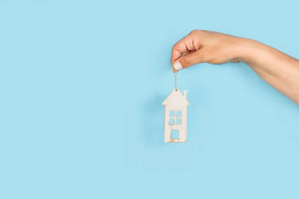 Woman Hand Holding White Wooden Toy House Light Blue Background — Stock Photo, Image