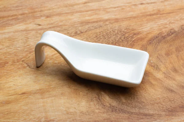 Rectangular Shape White Ceramic Spoon Wooden Table — Stock Photo, Image