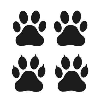 Beyaz arka planda siyah köpek ve kedi pençesi izleri.