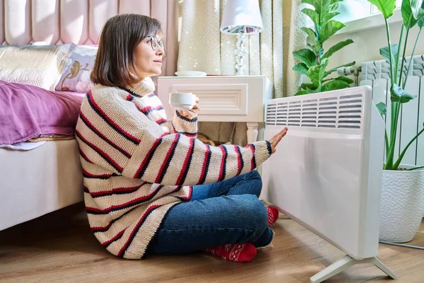 Woman Warming Bedroom Electric Heater Middle Aged Female Woolen Sweater — Stock Photo, Image