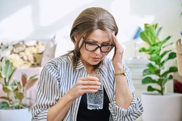 Mature Woman Suffering Headache Home Glass Water Health Stress Depression — Stockfoto