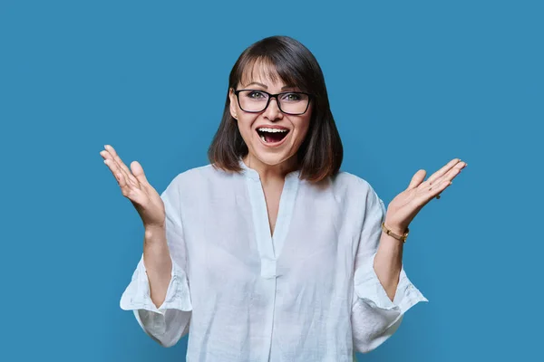 Emotional Happy Mature Woman Looking Camera Blue Color Studio Background — Stock Photo, Image