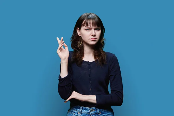 Dissatisfied Young Female Looking Camera Blue Studio Background Pouting Her — Foto Stock