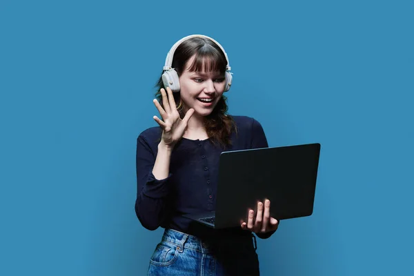 Cheerful Young Female Headphones Looking Laptop Blue Color Studio Background — Fotografia de Stock