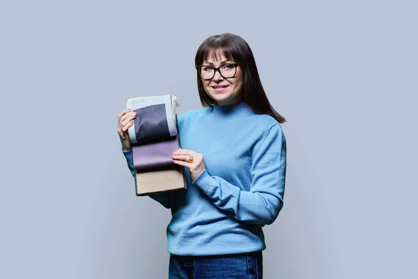 Woman Designer Decorator Holding Book Fabrics Light Studio Background Textile — Stock Photo, Image
