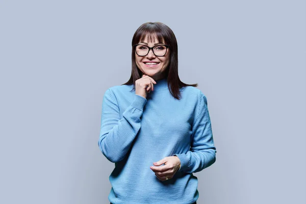 Portrait Positive Mature Woman Glasses Dressed Blue Jumper Light Gray — Stock Photo, Image