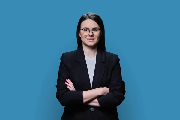 Confident Business Young Female Glasses Looking Camera Blue Color Background — Stockfoto