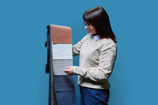 Woman Samples Fabrics Curtains Upholstery Blue Studio Background Female Designer — Stock Photo, Image