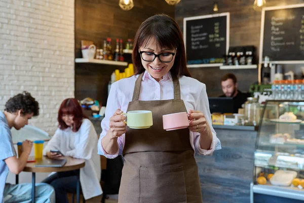 Portrait Smiling Female Coffee Shop Worker Holding Two Cups Coffee — Stock Photo, Image