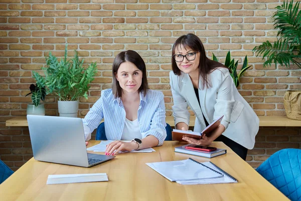 Two Happy Smiling Business Women Looking Camera Standing Office Successful — Stock Photo, Image