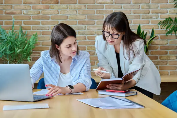 Two Serious Business Women Colleagues Sitting Large Table Office Business — Stock Photo, Image