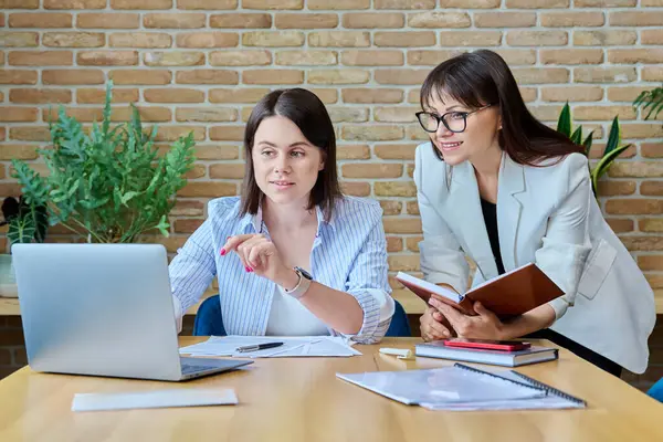 Two Serious Business Women Colleagues Sitting Large Table Office Typing — Stock Photo, Image