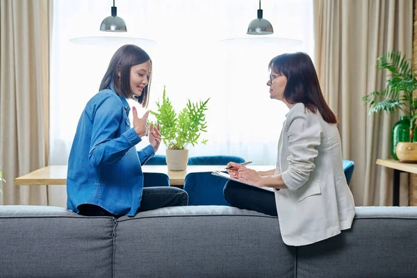 stock image Happy joyful young woman patient talking to female psychologist counselor at therapy session. Positive treatment results, mental health of youth. Psychology psychotherapy support help rehabilitation