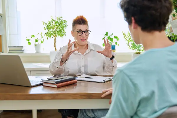 stock image Middle-aged female professional psychologist mental therapist talking with young man in office. Psychotherapist advisor working with male patient. Psychology psychotherapy support treatment assistance