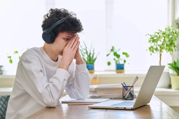 Sad Upset Young Guy Student Headphones Sitting Home Desk Computer — Stock Photo, Image