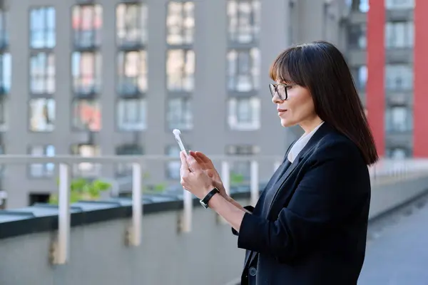 Mature Business Confident Female Using Smartphone Modern City Background Middle Stok Foto Bebas Royalti