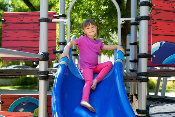 Child Playing Outdoor Playground Active Cheerful Girl Rides Slide — Stock Photo, Image