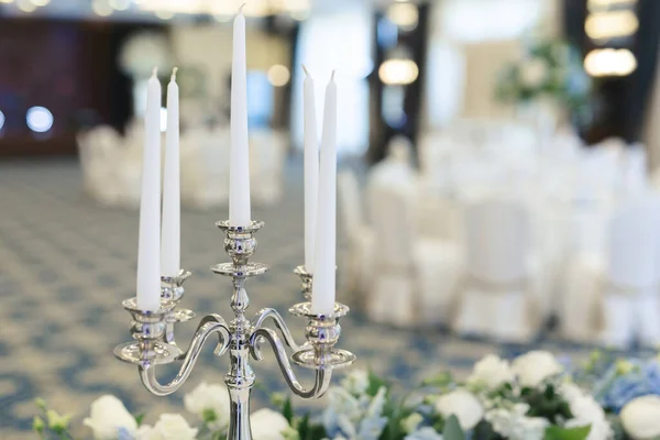 Wedding candle holder with floral decoration at the wedding banquet