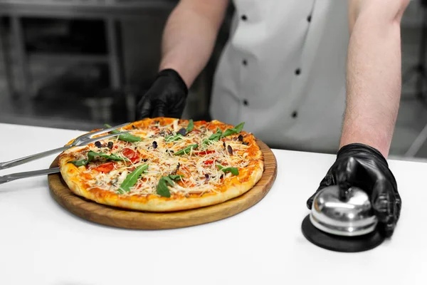 Cook with a ready-made dish with pizza.