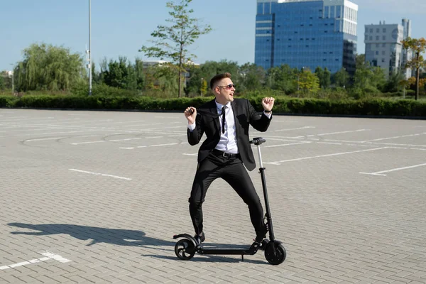 Young Handsome Businessman Suit Rides Electric Scooter City Laughs — Stock Photo, Image