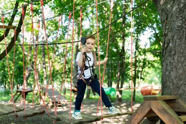 Small Boy Climbing Gear Walking Rope Road Adventure Park Holding — Stock Photo, Image
