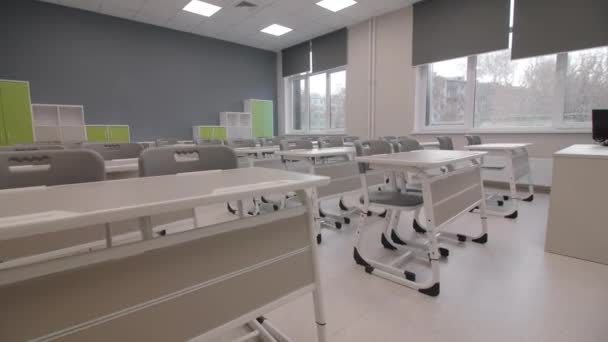 Desks Chairs Students Shelves Empty Classroom Large Windows Modern Interior — Stock Video