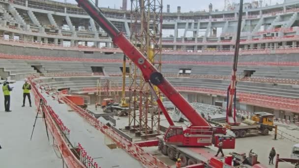 Powerful Cranes Builders Work Future Sports Arena Construction Site Professional — Stockvideo
