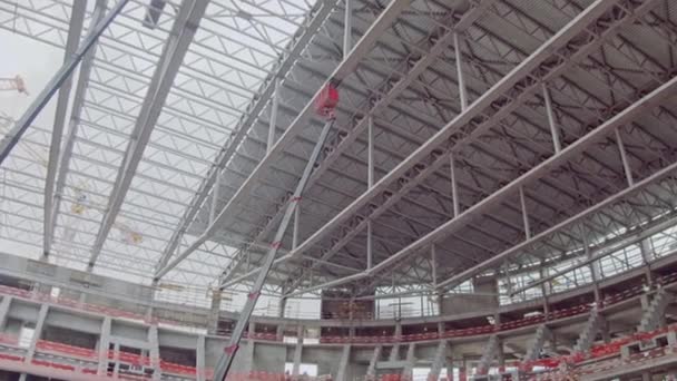 Roof Carcass Supported Crane Hoists Sports Stadium Construction Site Low — Vídeos de Stock
