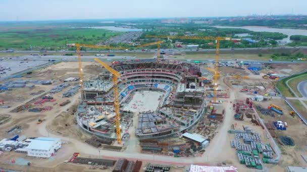 Unfinished Sports Stadium Cranes Construction Site Calm River Bird Eye — Vídeos de Stock