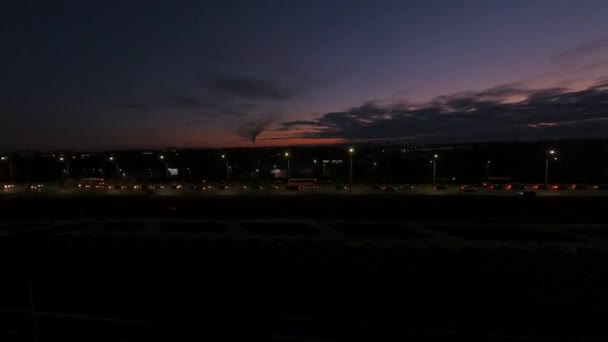 Cars Drive Dark Highway Brightly Lit Sports Stadium Building Late — стокове відео