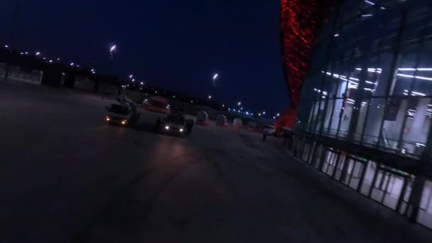 Truck Cranes Illuminated Sports Arena Glass Facade Large Yard Night — стоковое видео
