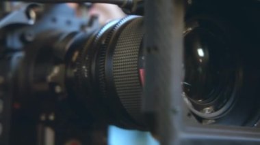 ALMATY, KAZAKHSTAN - JANUARY 27 2023: Big lens of professional camera for shooting film on set. Skilled cinematographer controls operation of modern equipment closeup on January 27 in Almaty