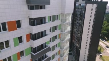 Modern comfortable apartment buildings in city district on sunny day aerial view. Multistory residential complex