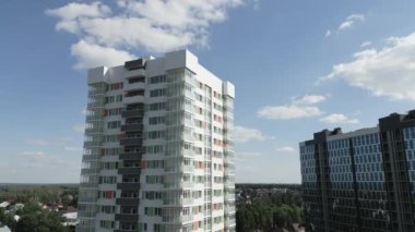 Multistory residential buildings near old district in city on summer day aerial view. Urban architecture development