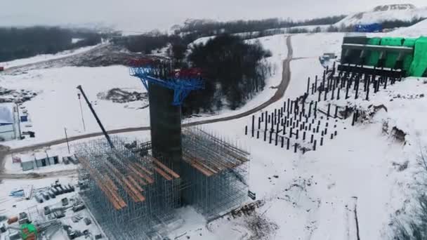 Concrete Column Metal Carcass Scaffolds Snowy Valley Bird Eye View — Stock Video