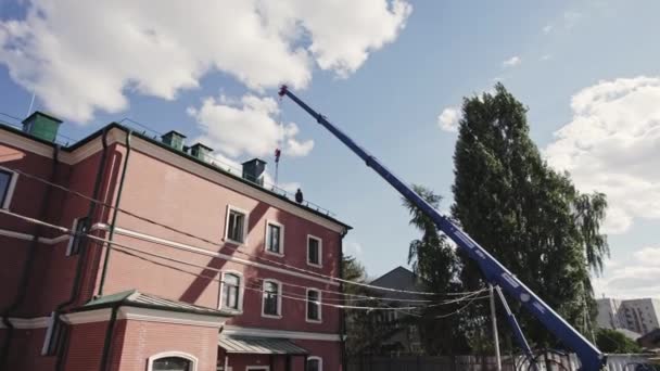Construction Crane Unloads Necessary Materials Restore Roof Public Building Building — Stock Video