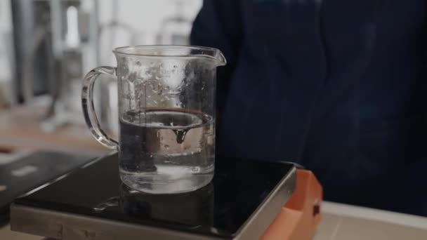Beaker Swirling Transparent Liquid Test Device Laboratory Closeup Lab Assistant — стокове відео