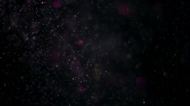 Parlayan parçacıkların ve kıvılcımların arka planı.