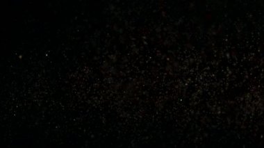 Parlayan parçacıkların ve kıvılcımların arka planı.