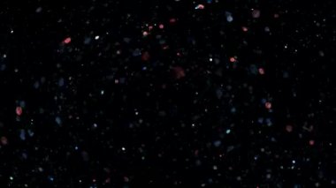 Parlayan parçacıkların ve kıvılcımların arka planı