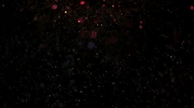 Parlayan parçacıkların ve kıvılcımların arka planı