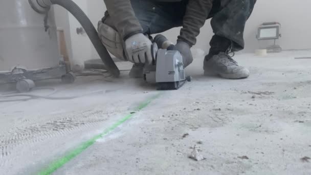Man Makes Recesses Concrete Floor Installing Underfloor Heating Wall Chaser — Stock Video