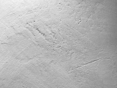 Arka plan için eski, pejmürde, kaba bir duvar parçası.