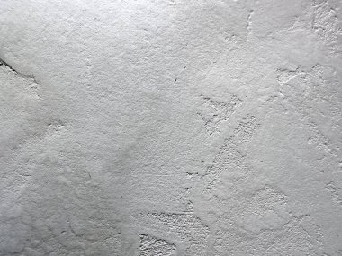 Arka plan için eski, pejmürde, kaba bir duvar parçası.