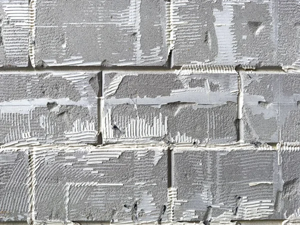 stock image Fragment of an old, shabby, rough wall for the background