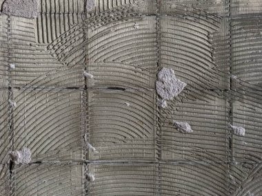 Arka plan için eski, pejmürde, kaba bir duvar parçası.