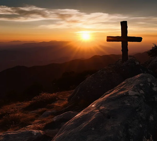 Silhouette of a Christian cross on a mountain at sunset. Resurrection concept