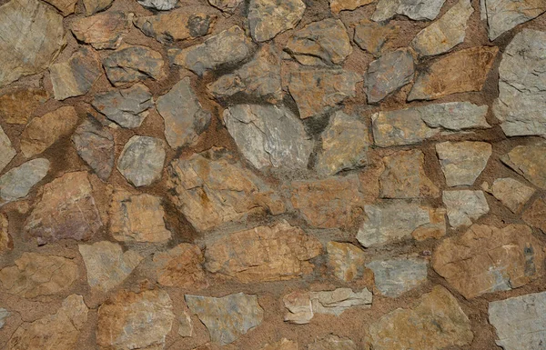 背景や質感としての天然石の壁の断片 石の壁の構造について 古い城の石の壁の質の背景 メイソンリー — ストック写真
